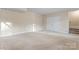 Unfinished basement with neutral carpeting and storage at 310 Pine St, Locust, NC 28097