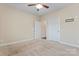 Well-lit bedroom with access to hallway and bath at 310 Pine St, Locust, NC 28097
