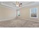 Spacious bedroom with ceiling fan and neutral carpeting at 310 Pine St, Locust, NC 28097