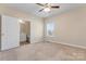 Charming bedroom with ensuite bathroom access at 310 Pine St, Locust, NC 28097