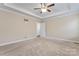Bright bedroom featuring ceiling fan and ample space at 310 Pine St, Locust, NC 28097