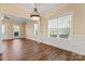 Bright dining room with hardwood floors and wainscoting at 310 Pine St, Locust, NC 28097