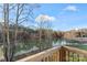 Scenic view of a serene lake from a deck at 310 Pine St, Locust, NC 28097