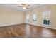 Spacious living room with hardwood floors and ceiling fan at 310 Pine St, Locust, NC 28097