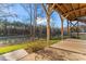 Covered patio with serene lake view at 310 Pine St, Locust, NC 28097