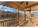 Relaxing screened porch with lake view and string lights at 310 Pine St, Locust, NC 28097