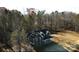 Aerial view of two-story home on wooded lot at 357 Triple Ponds Ct, Clover, SC 29710