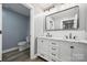 Modern bathroom features a double vanity, marble countertop, and sleek black fixtures at 357 Triple Ponds Ct, Clover, SC 29710