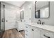 Bathroom showcasing double vanities with marble countertops, modern faucets, and matte black hardware at 357 Triple Ponds Ct, Clover, SC 29710