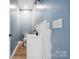 Powder room with modern fixtures, unfinished wall, and wood-look floors at 357 Triple Ponds Ct, Clover, SC 29710