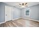 Bedroom featuring vinyl plank flooring, a ceiling fan, and an interior door at 357 Triple Ponds Ct, Clover, SC 29710