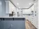 Kitchen with white cabinets, breakfast bar seating, and modern countertops at 357 Triple Ponds Ct, Clover, SC 29710