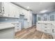 Eat-in kitchen featuring white cabinets, modern countertops, and ample storage space at 357 Triple Ponds Ct, Clover, SC 29710