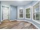 Sun-drenched living area with multiple windows and wood-look flooring at 357 Triple Ponds Ct, Clover, SC 29710