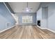 Bright living room showcasing a fireplace, large windows, and vaulted ceilings with fan at 357 Triple Ponds Ct, Clover, SC 29710