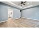 Open main bedroom with ensuite bath and lots of open space with light-blue walls at 357 Triple Ponds Ct, Clover, SC 29710