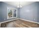 Light-filled room showcasing stylish vinyl floors and an airy ambiance enhanced by a window with backyard views at 357 Triple Ponds Ct, Clover, SC 29710