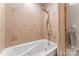 Bathroom features a jetted tub with tiled surround and a handheld shower fixture at 1065 Gauguin Ln, Fort Mill, SC 29708
