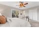 Cozy bedroom with sliding glass doors, a spacious closet, and soft carpeting at 1065 Gauguin Ln, Fort Mill, SC 29708
