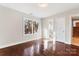 Inviting bedroom with hardwood floors, bright window, and a door to an ensuite bathroom at 1065 Gauguin Ln, Fort Mill, SC 29708
