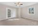Bright bedroom featuring neutral carpet and access to an outdoor balcony at 1065 Gauguin Ln, Fort Mill, SC 29708