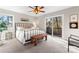 Relaxing bedroom featuring sliding glass doors, large windows, and a modern bench at 1065 Gauguin Ln, Fort Mill, SC 29708