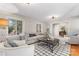 Bright living room with a comfortable couch, patterned rug and plenty of natural light at 1065 Gauguin Ln, Fort Mill, SC 29708