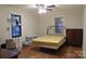 Bedroom features hardwood floors, a ceiling fan, and natural light at 155 6Th Sw St, Taylorsville, NC 28681