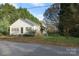 Quaint single-story home featuring white siding, mature trees and an easy to maintain front yard at 155 6Th Sw St, Taylorsville, NC 28681