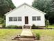 Charming single-story home featuring a well-manicured front yard and welcoming entrance at 155 6Th Sw St, Taylorsville, NC 28681