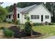 Classic home with a brick chimney, tidy landscaping, and inviting curb appeal at 155 6Th Sw St, Taylorsville, NC 28681