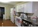 Functional kitchen with white appliances, wooden countertops, and ample storage space at 155 6Th Sw St, Taylorsville, NC 28681