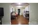 Open concept kitchen with hardwood floors, white cabinetry, and a breakfast nook at 155 6Th Sw St, Taylorsville, NC 28681
