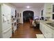 Open kitchen and dining area, hardwood floors, and white cabinetry at 155 6Th Sw St, Taylorsville, NC 28681