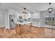 Modern kitchen featuring white cabinets, stainless steel appliances, and a copper island at 190 Williamson St, Troy, NC 27371