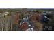 Aerial view showing condo complex with mature trees and fall colors at 194 E Jay Dr # 3, Taylorsville, NC 28681