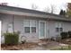 Backyard features a small patio area with an exterior door and an established shrub at 194 E Jay Dr # 3, Taylorsville, NC 28681