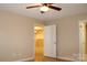 Cozy bedroom with hardwood floors, ceiling fan, and inviting doorway with an open door at 194 E Jay Dr # 3, Taylorsville, NC 28681