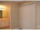 Bedroom with a neutral palette featuring a closet and ensuite bathroom with a single sink and vanity at 194 E Jay Dr # 3, Taylorsville, NC 28681