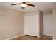 Neutral bedroom featuring wood floors, ceiling fan, and closet with folding doors at 194 E Jay Dr # 3, Taylorsville, NC 28681