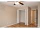Bedroom features wood floors, ceiling fan, closet, and decorative wall art at 194 E Jay Dr # 3, Taylorsville, NC 28681