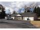 Exterior view of a multi-Gathering home with private garages and landscaping, creating a comfortable living environment at 194 E Jay Dr # 3, Taylorsville, NC 28681