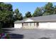 Inviting townhome with a stone facade, two-car garage, and ample parking spaces at 194 E Jay Dr # 3, Taylorsville, NC 28681