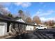 Inviting townhome exterior featuring stone accents, a single-car garage, and well-maintained landscaping at 194 E Jay Dr # 3, Taylorsville, NC 28681