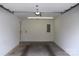 Garage featuring a utility door and lighting with a concrete floor, providing secure parking and storage space at 194 E Jay Dr # 3, Taylorsville, NC 28681