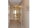 Bright hallway featuring neutral walls, tiled floors, and multiple doors offering access to other rooms at 194 E Jay Dr # 3, Taylorsville, NC 28681