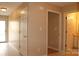Interior view of a hallway and doors with tile flooring and light colored walls, offering access to various rooms at 194 E Jay Dr # 3, Taylorsville, NC 28681