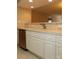 Updated kitchen featuring a double sink, white cabinetry, stainless steel appliances, and tile backsplash at 194 E Jay Dr # 3, Taylorsville, NC 28681