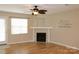 Well-lit living room featuring a fireplace, a ceiling fan, and a view to the outdoor at 194 E Jay Dr # 3, Taylorsville, NC 28681