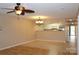 Open living area with wood and tile flooring, a ceiling fan, and a view of the kitchen at 194 E Jay Dr # 3, Taylorsville, NC 28681